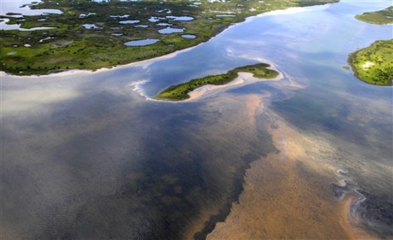 In this May 6 photo, an aerial view of the northern Chandeleur barrier islands shows sheens of oil reaching land in the Gulf of Mexico. The islands rest 20 miles from the main Louisiana coastline.
